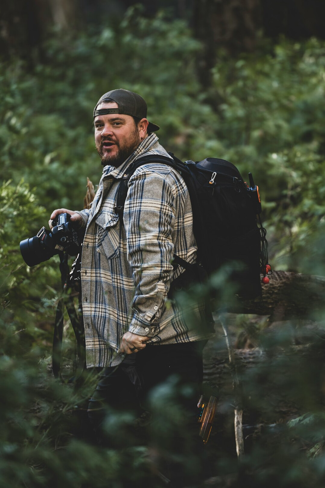 Portrait of a documentary photographer with camera equipment