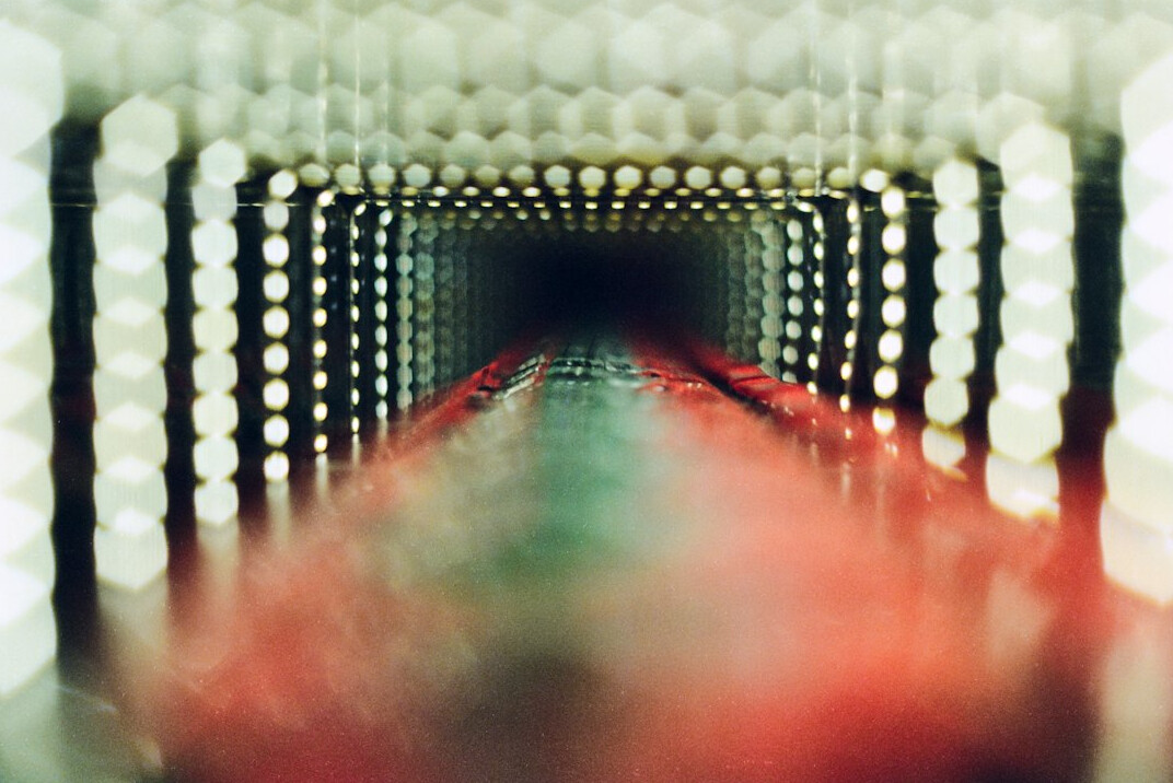 Film negatives and photographic prints laid out on a lightbox