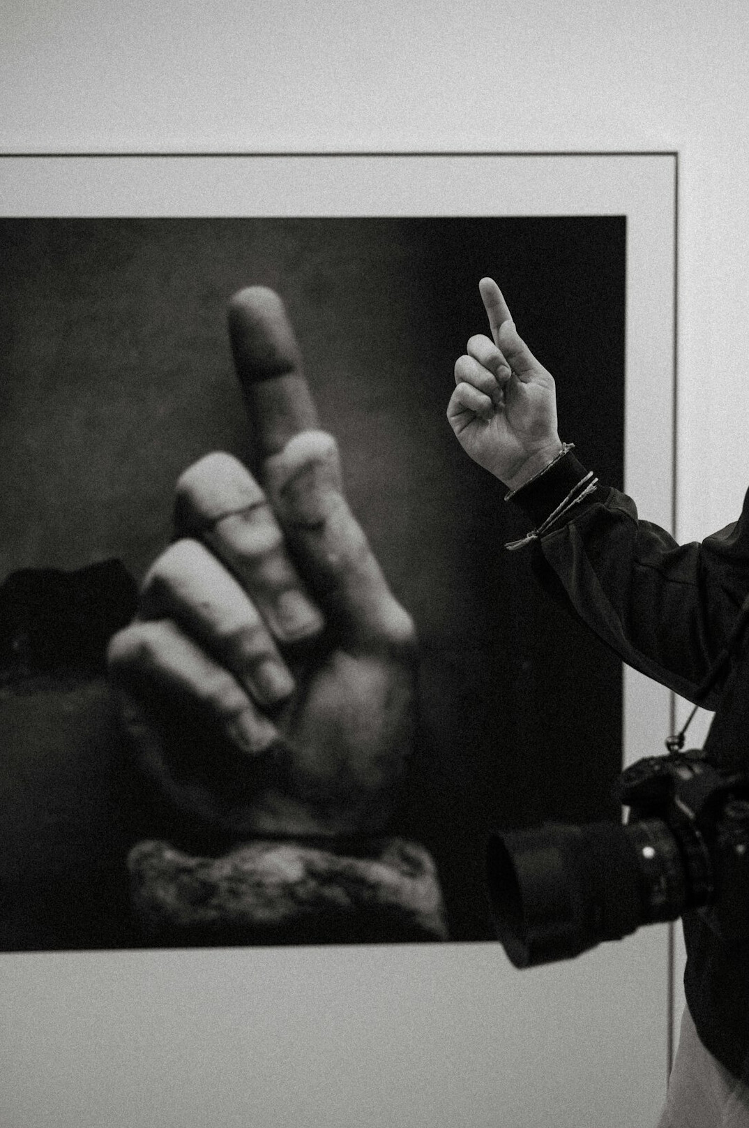 Hands carefully framing a fine art black and white photographic print